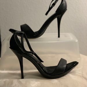Black ankle strap high heels.